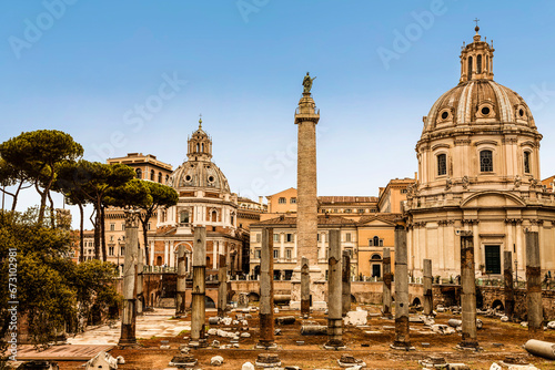 View of Trajan's Forum with Trajan's column, the ruins of the Basilica of Ulpia, and the churches of the Most Holy Name of Mary and Santa maria di loreto, Rome, Italy photo