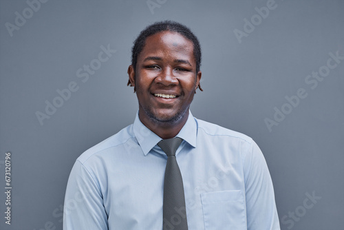 portrait of afro american young man on gray background