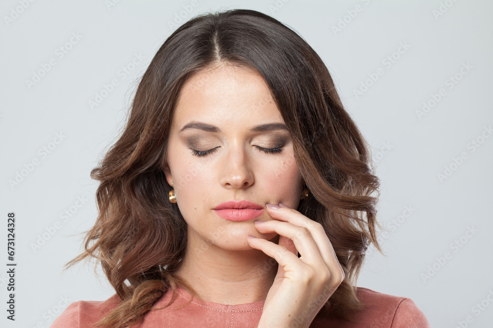Lovely female face with makeup and natural clean skin without retouch. Young perfect woman without retouching, closeup studio portrait Lovely female face with makeup and natural clean skin without retouch. Young perfect woman without retouching, closeup studio portrait