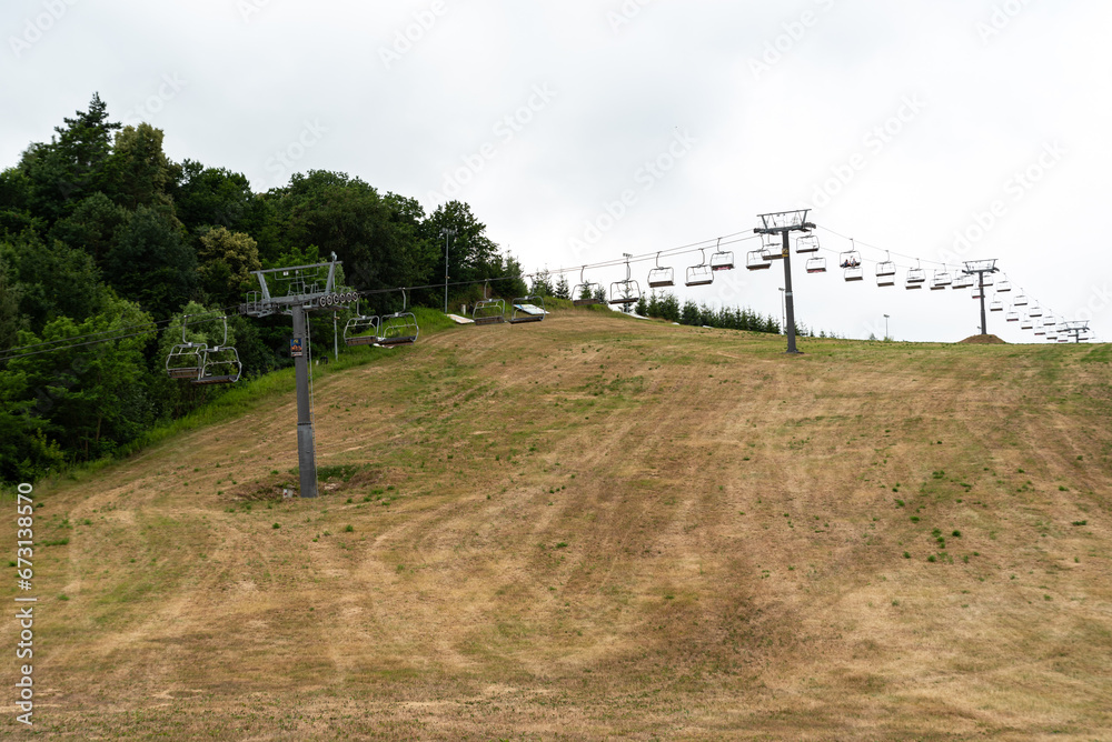 Baltow, Poland - July 2, 2022: Cable car in the summer season. Chairlift in summer without people.