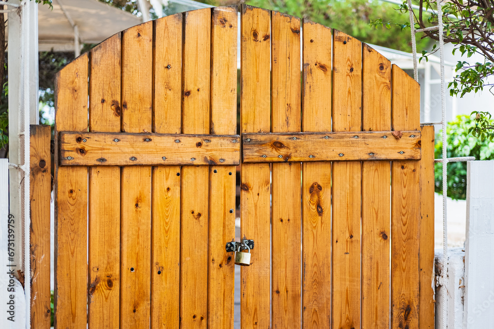 Traditional double wooden gates with padlock. Traditional double wooden gates with padlock.