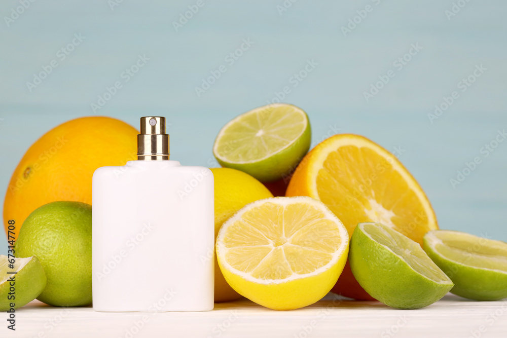 Perfume with citrus extracts. Selective focus. Spa day, concept of freshness perfume bottle with lemon lime and orange slices Perfume with citrus extracts. Selective focus. Spa day, concept of freshness perfume bottle with lemon lime and orange slices