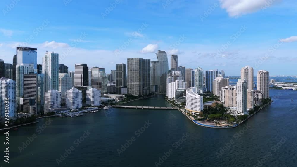 Breathtaking wide view of futuristic waterfront buildings on human-made Cloughton island and mainland in Miami. Brickell Key providing amenities and luxuries of urban living Breathtaking wide view of futuristic waterfront buildings on human-made Cloughton island and mainland in Miami. Brickell Key providing amenities and luxuries of urban living