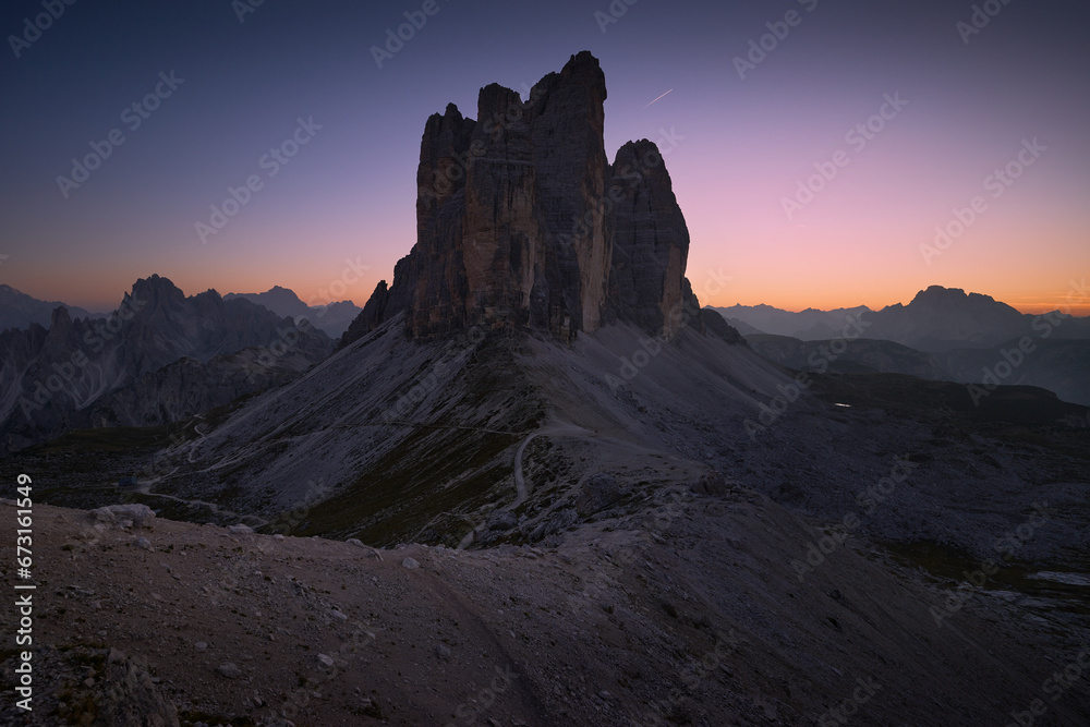 Evening landscape after sunset in the Italian Dolomites. Panoramic view of Tre Cime di Lavaredo. Blue hour in the mountains