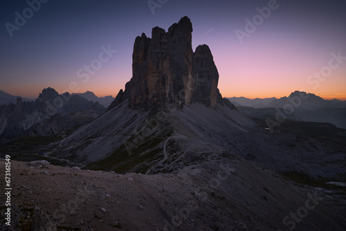 Evening landscape after sunset in the Italian Dolomites. Panoramic view of Tre Cime di Lavaredo. Blue hour in the mountains photo