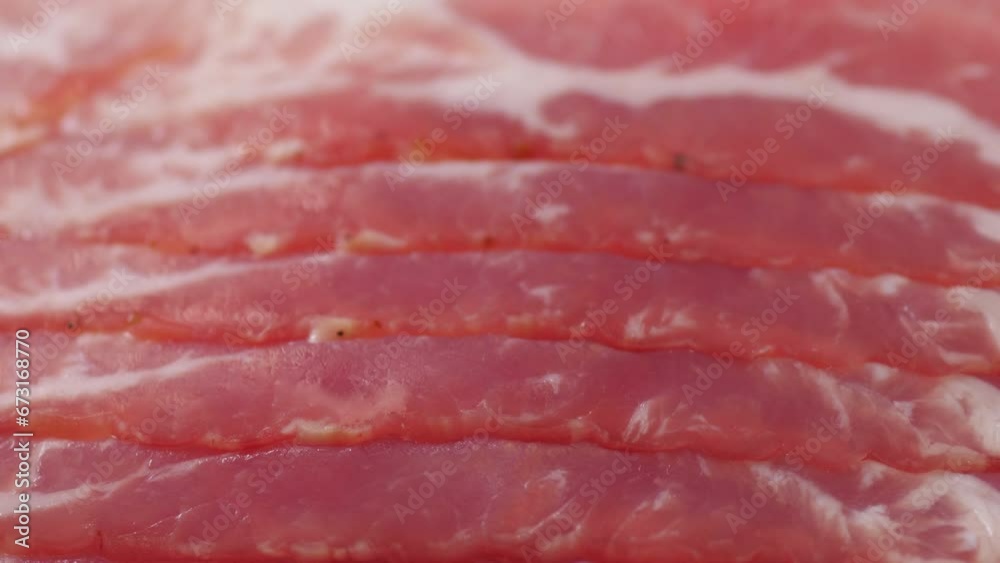 Raw sliced bacon ready for cooking . Ingredient of bacon. Prosciutto ready to eat. Raw sliced bacon ready for cooking . Ingredient of bacon. Prosciutto ready to eat.