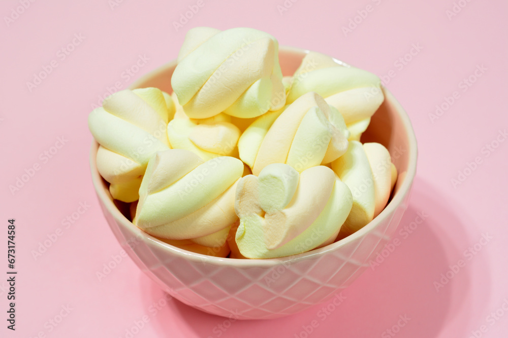 yellow marshmallows in pink bowl close up yellow marshmallows in pink bowl close up
