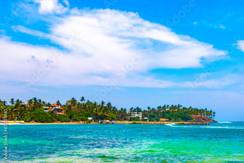 Fototapeta Naklejka Na Ścianę i Meble -  Beautiful paradise tropical beach waves palms Mirissa Beach Sri Lanka.