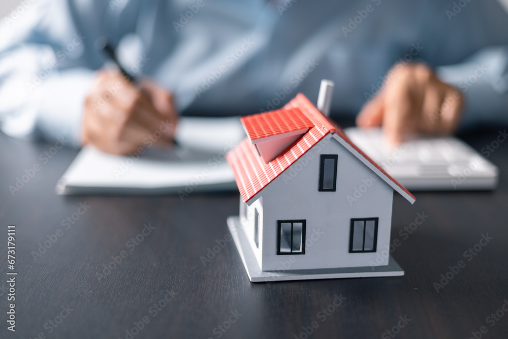 House with money. Concept of finance or refinance real estate. Symbol of house stands against background of us dollars. Property investment. Home mortgage loan rate. Saving money for retirement. House with money. Concept of finance or refinance real estate. Symbol of house stands against background of us dollars. Property investment. Home mortgage loan rate. Saving money for retirement.