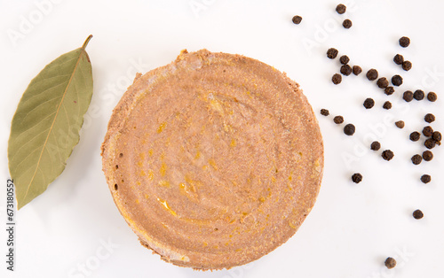 piece of beef pork liver pate on the white background with peppers