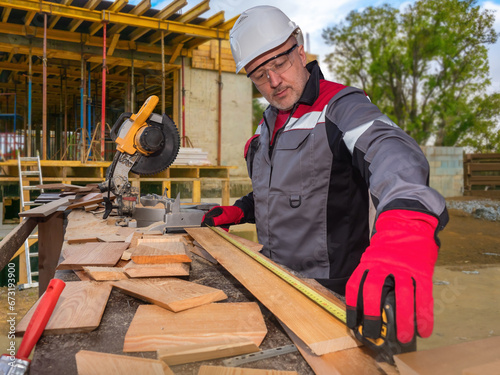 Man builder. Worker uses ci...