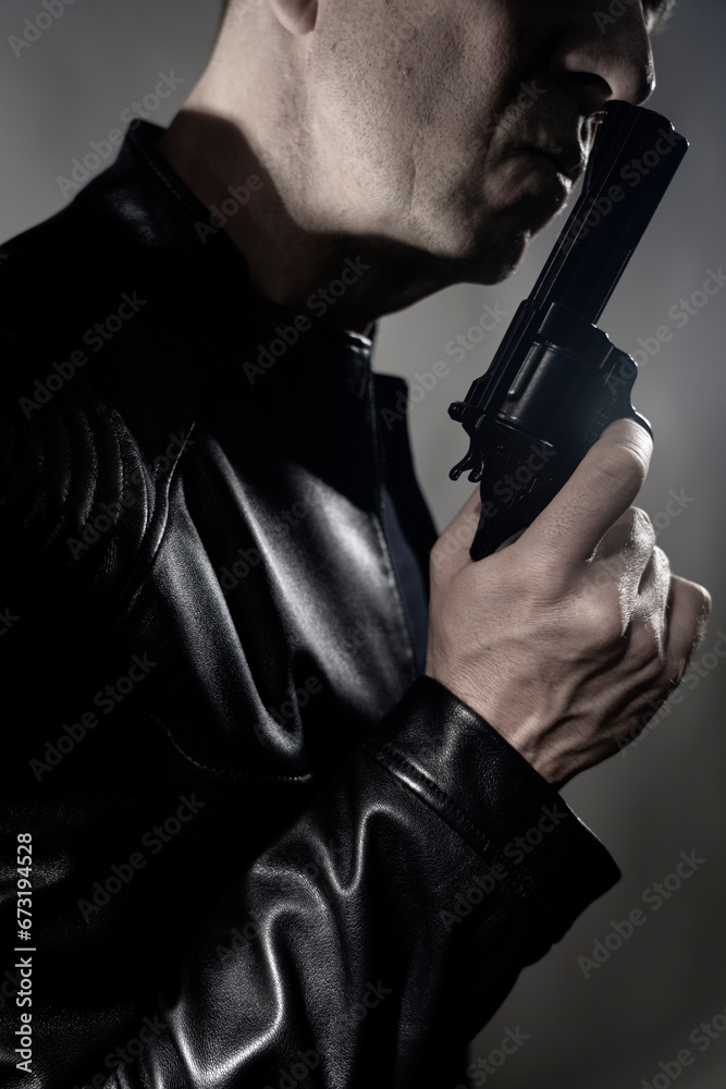 Black leather jacket hitman spy with gun Black leather jacket hitman spy with gun