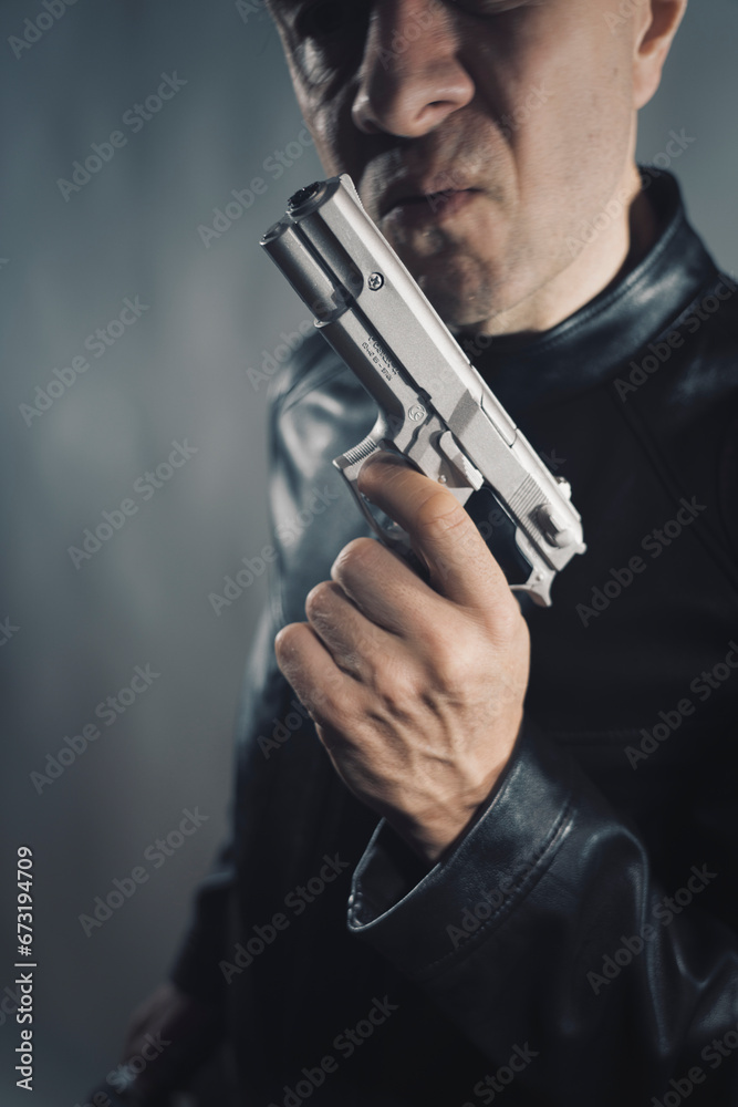 Black leather jacket hitman spy with gun