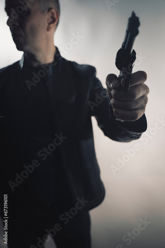 Detective spy thriller man with gun photo