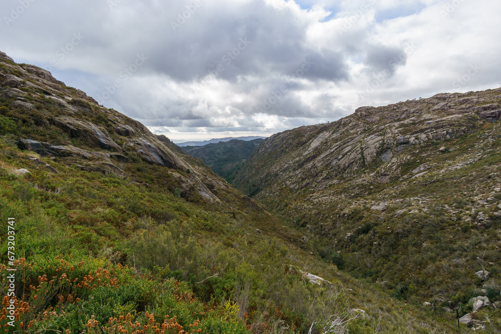 Mountain landscape of granite rocks with green vegetation, Peneda-Geres National Park, Vilar da Veiga, Portugal