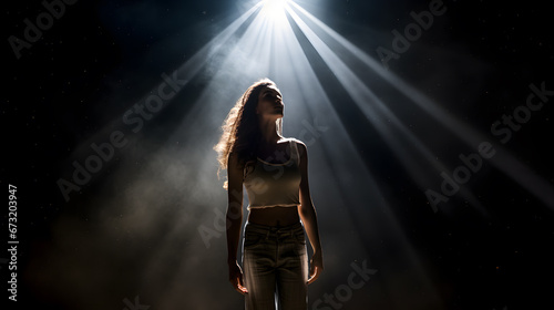 woman standing in the spotlight