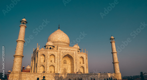 Amazing view on the Taj Mahal during sunrise. The Taj Mahal is an ivory-white marble mausoleum on the south bank of the Yamuna river. Agra, Uttar Pradesh, India (ID: 673205359)