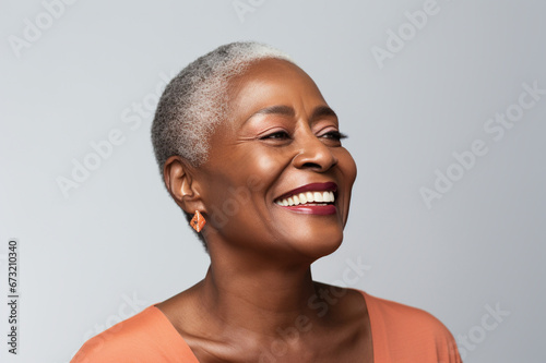 Age model on white background, a mature woman with a confident smile