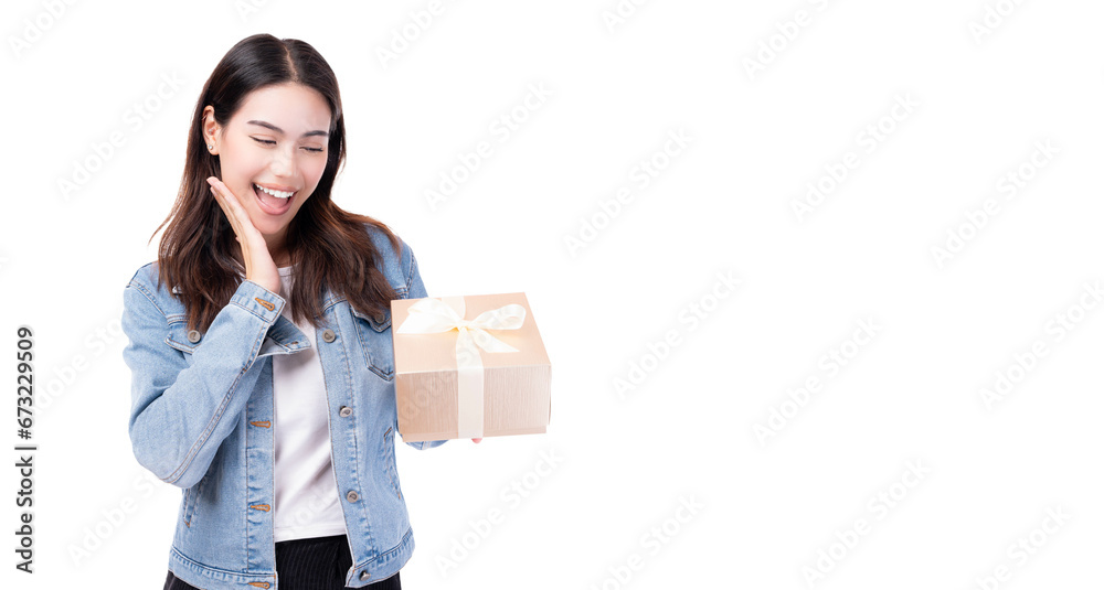 Surprised young woman holding gift box and get excited by open mouth Standing over isolated on white background Beautiful girl happy smile hold new year gift box present Celebrate New Year Christmas Surprised young woman holding gift box and get excited by open mouth Standing over isolated on white background Beautiful girl happy smile hold new year gift box present Celebrate New Year Christmas