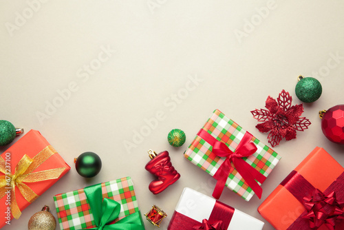 Christmas composition. Gifts, with green and red decorations on grey background. New year concept.