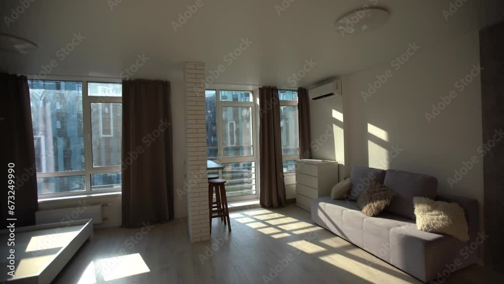 Modern room, home office interior. Room with sofa, desk, chair, small table and other furniture.