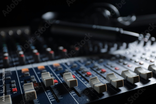 Microphone with audio mixer in the control room audio system. photo