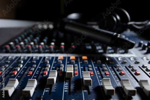 Microphone with audio mixer in the control room audio system.