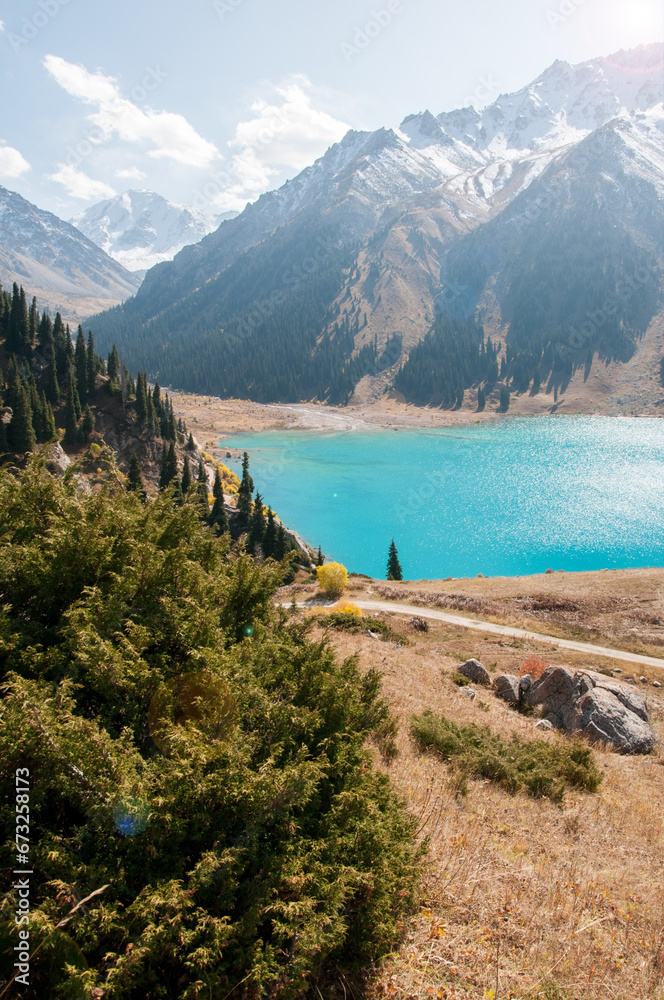 BAL or Big Almaty Lake located in the Republic of Kazakhstan with snow-covered mountain peaks in the background