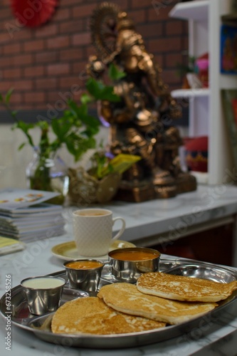 Delicious South Indian meal spread  featuring mini uthappam  coconut and tomato chutney  sambar