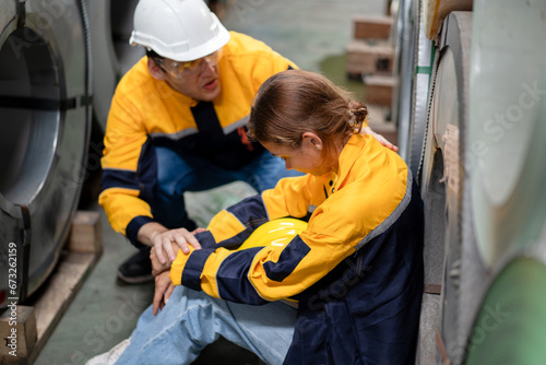 tired female worker feeling sick after stressed work in manufacturing factory, exhausted woman technician has problem working overload, male foreman support consoling and encorage at metal warehouse