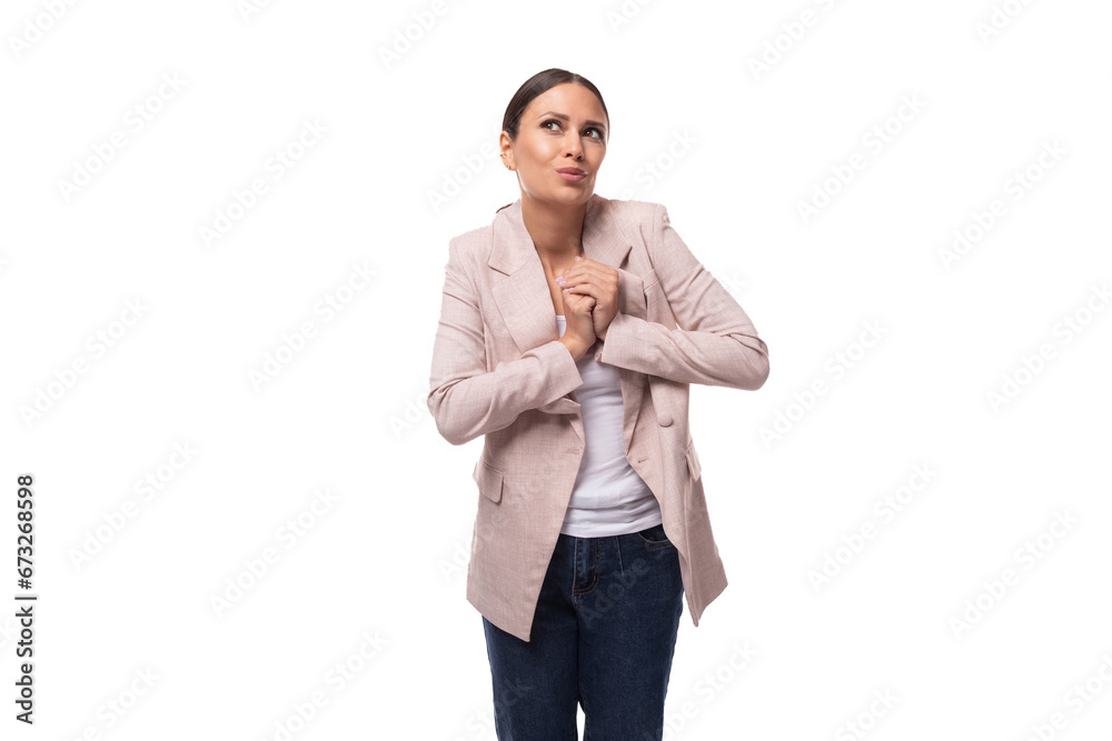 young charismatic business woman leader with a ponytail hairstyle is dressed in a beige jacket