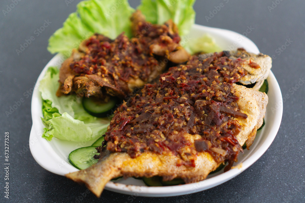Fried Fish with Chile Paste. Traditional Indonesian and Malaysian Dish Fried Fish with Chile Paste. Traditional Indonesian and Malaysian Dish