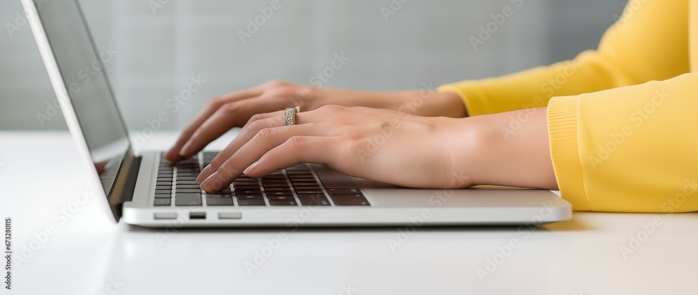 Female hands typing on the computer laptop Female hands typing on the computer laptop