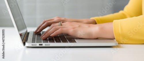 Female hands typing on the computer laptop