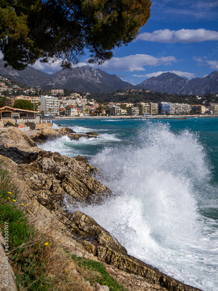 A rocky beach with high waves at the Roquebrune-Cap-Martin, Cote d'Azur, France