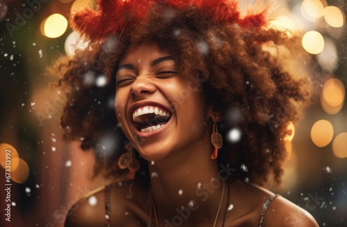 Joyful young Black woman in orange attire, laughing amidst a burst of confetti. Ideal for celebrations, event promotions, or marketing campaigns targeting youthful audiences. © StockWorld