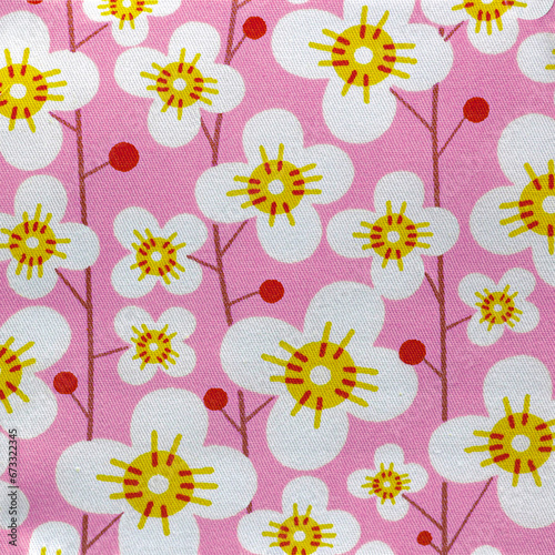 Floral pattern cotton fabric design closeup in pink and white