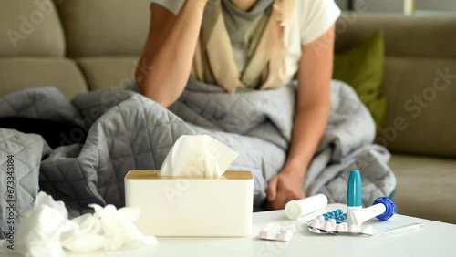 Wallpaper Mural Medicines and medical supplies are laid out on the table. The woman takes a glass of medicine from the table and drinks. Illness and poor health at home Torontodigital.ca
