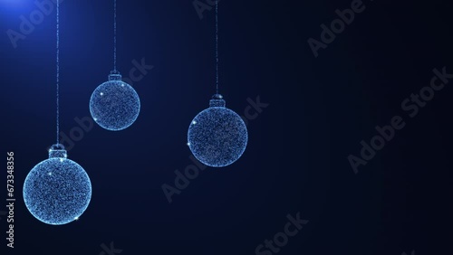 Spinning and swaying blue balls made of blue and white sparkling particles. Christmas decoration. Blue background for congratulations.