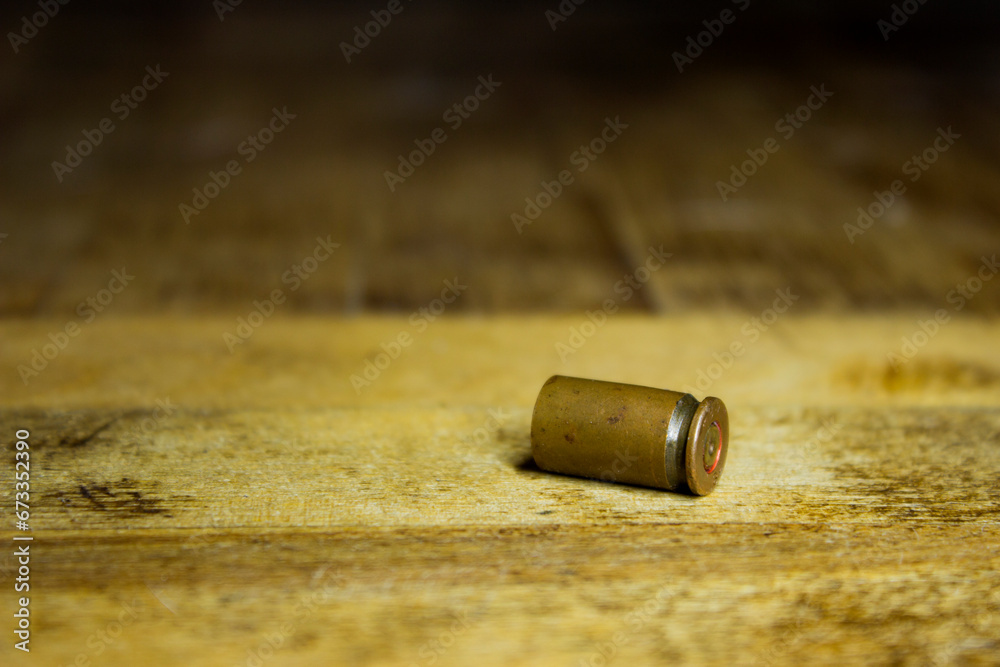 Bullet on wooden to check evidence of crime. Bullet on wooden to check evidence of crime.