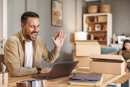 Small business owner packing in the cardbox at workplace