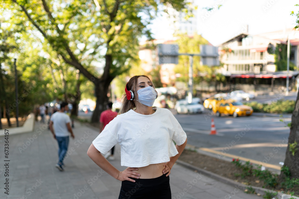 girl does sports with mask on the street during coronavirus girl does sports with mask on the street during coronavirus