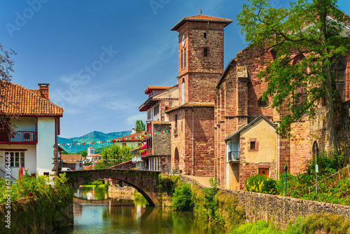 Scenic view of a picturesque French town crossed by a tranquil river. Saint-Jean-Pied-de-Port, France photo