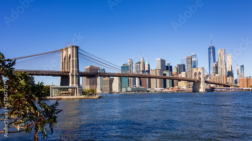 The Brooklyn bridge with Manhattan downtown in background © Jasongeorge