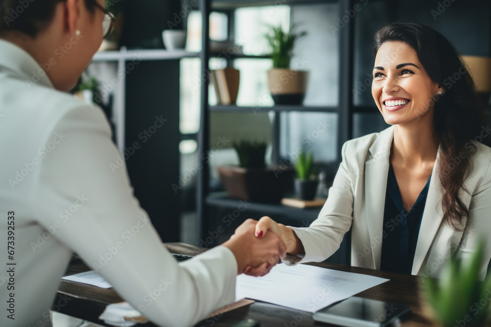 Happy mid aged business woman manager handshaking at office meeting. Smiling female hr hiring recruit at job interview, bank or insurance agent, lawyer making contract deal with client at work. - obrazy, fototapety, plakaty 
