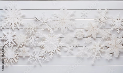Flat lay with decorative snowflakes on a white wooden table top, AI generator