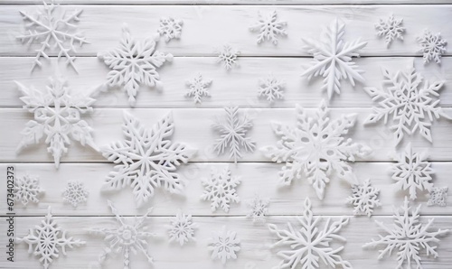 Flat lay with decorative snowflakes on a white wooden table top, AI generator