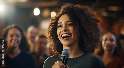 a smiling woman is holding a microphone