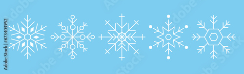 Set of white snowflakes on blue. New Year theme. Vector