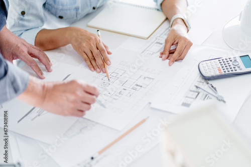 Engineer or interior Architects designer construction plans on blueprint.